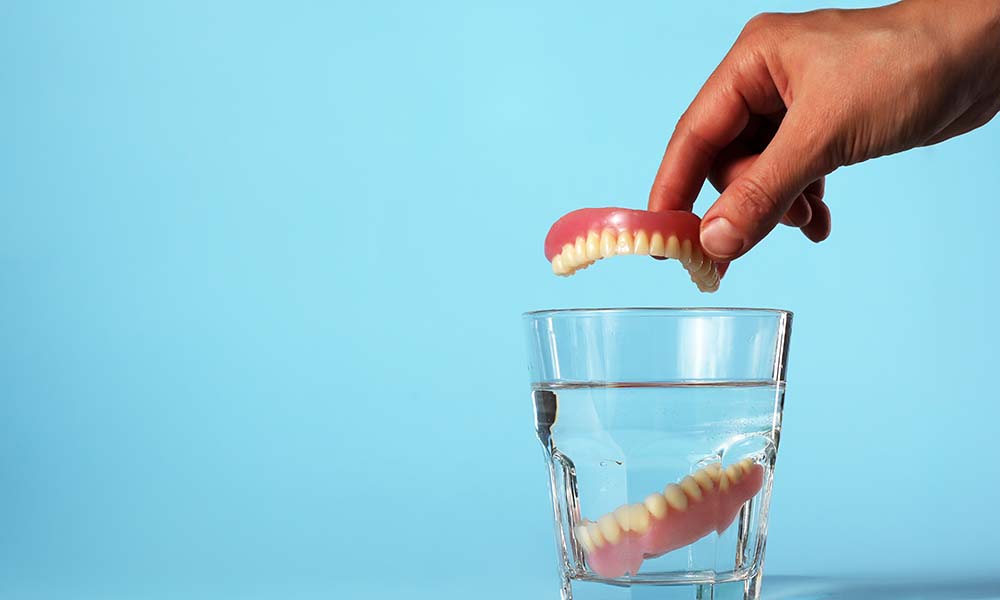 what should i soak my dentures in at night