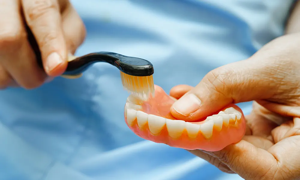 how to clean stained dentures
